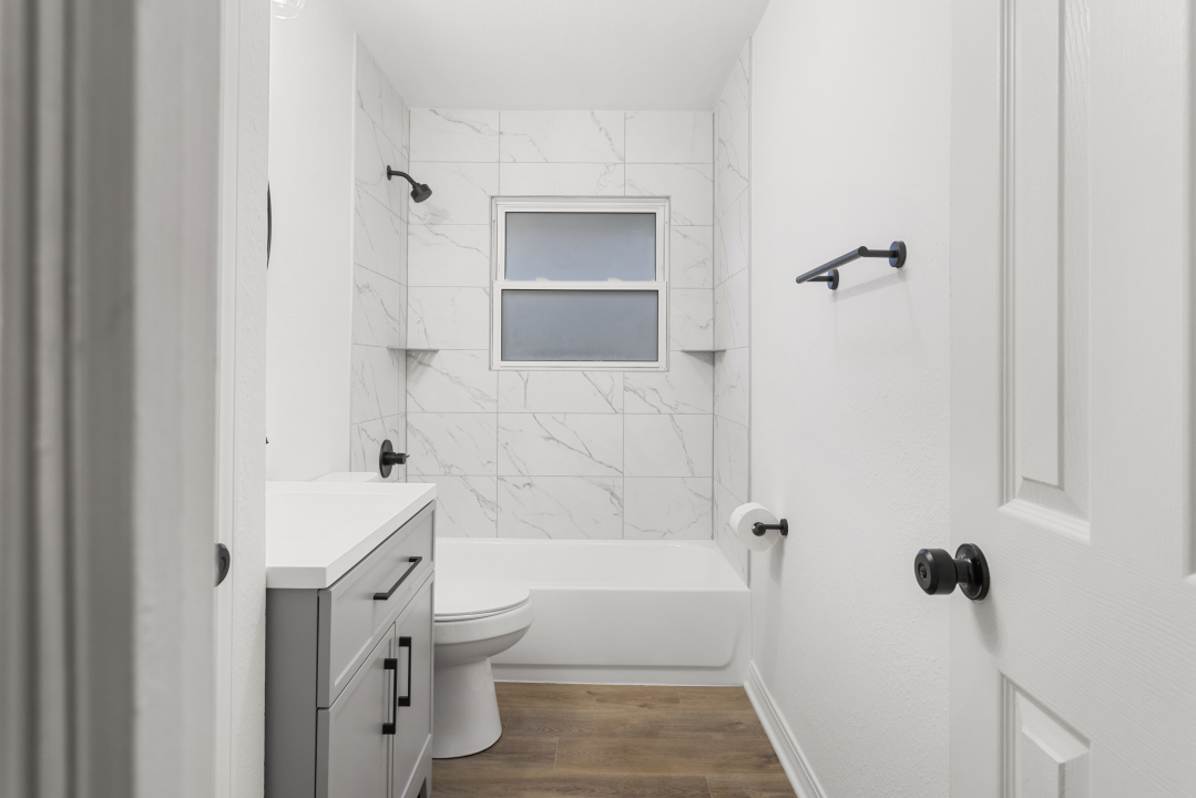 2803 Maplewood Drive Champaign, IL 61821 - Photo 24 of 39 a bathroom with a bathtub and shower