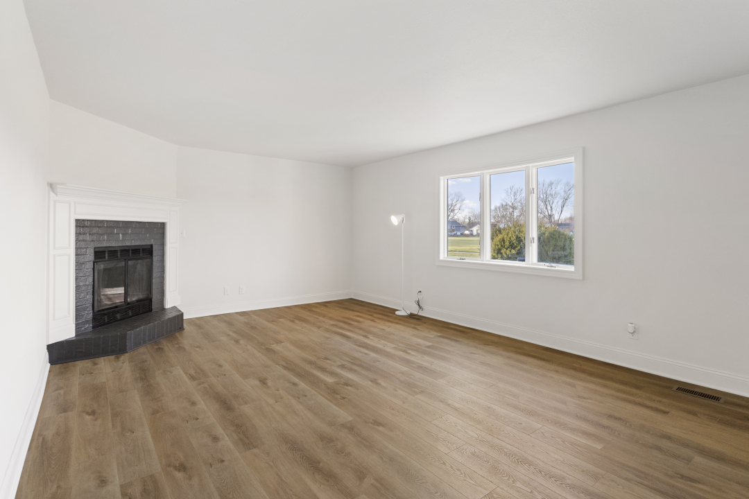 2803 Maplewood Drive Champaign, IL 61821 - Photo 33 of 39 wooden floor in an empty room with a window