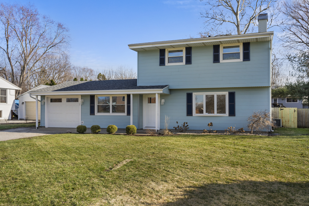 2803 Maplewood Drive Champaign, IL 61821 - Photo 34 of 39 a front view of a house with a yard