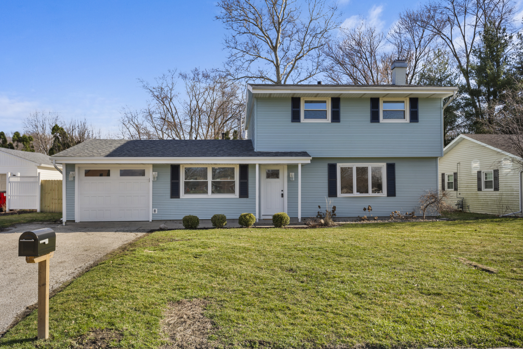 2803 Maplewood Drive Champaign, IL 61821 - Photo 39 of 39 a front view of a house with a yard