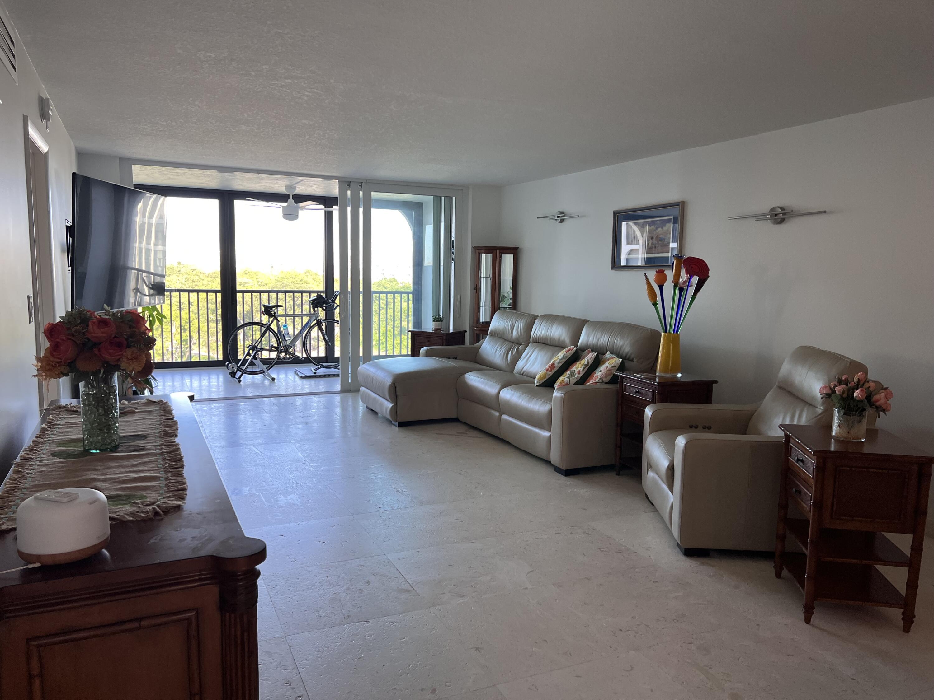 1629 Riverview Road, Unit 716 Deerfield Beach, FL 33441 - Photo 13 of 44 a living room with furniture and a large window