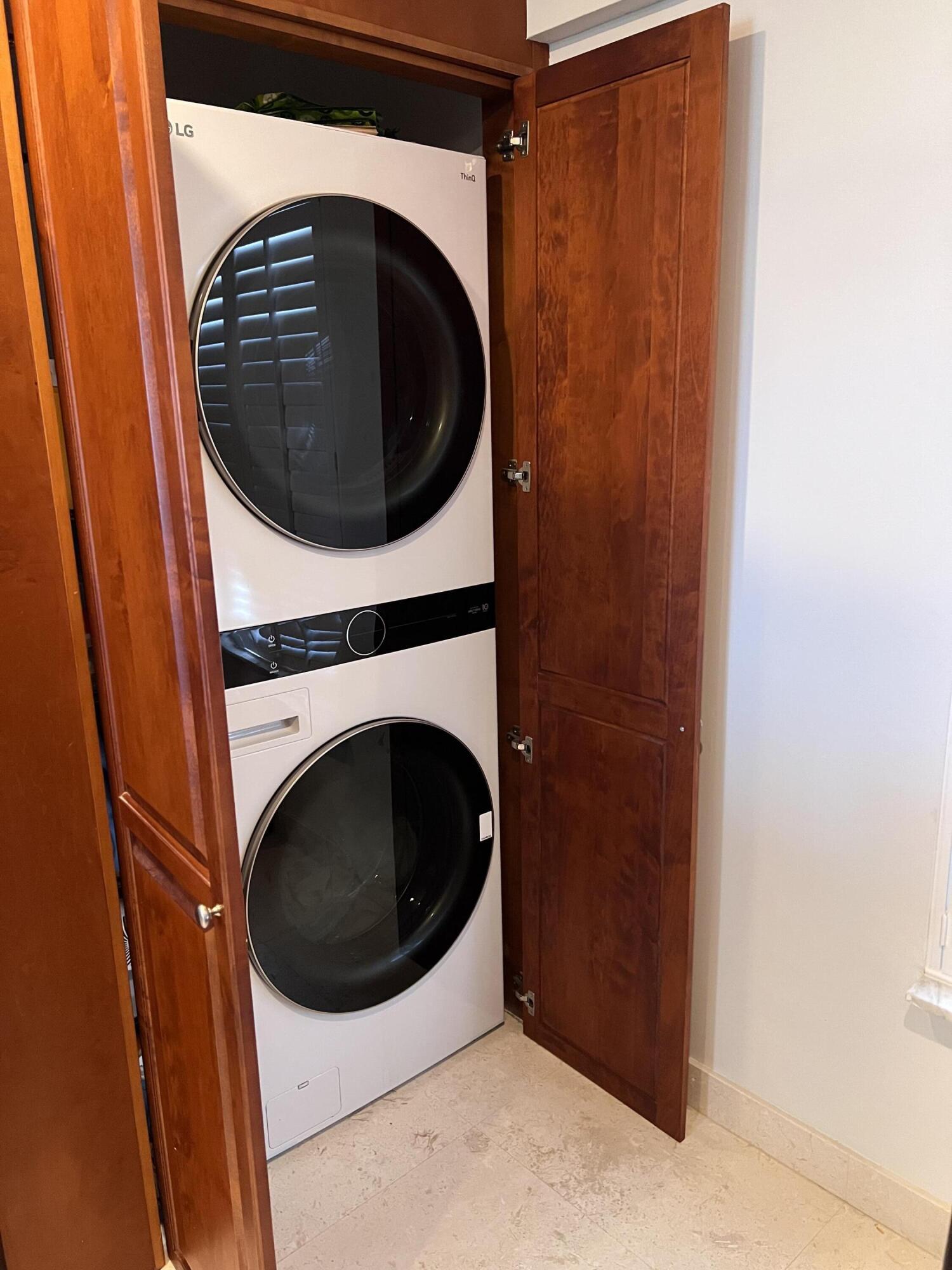 1629 Riverview Road, Unit 716 Deerfield Beach, FL 33441 - Photo 19 of 44 a utility room with dryer and washer