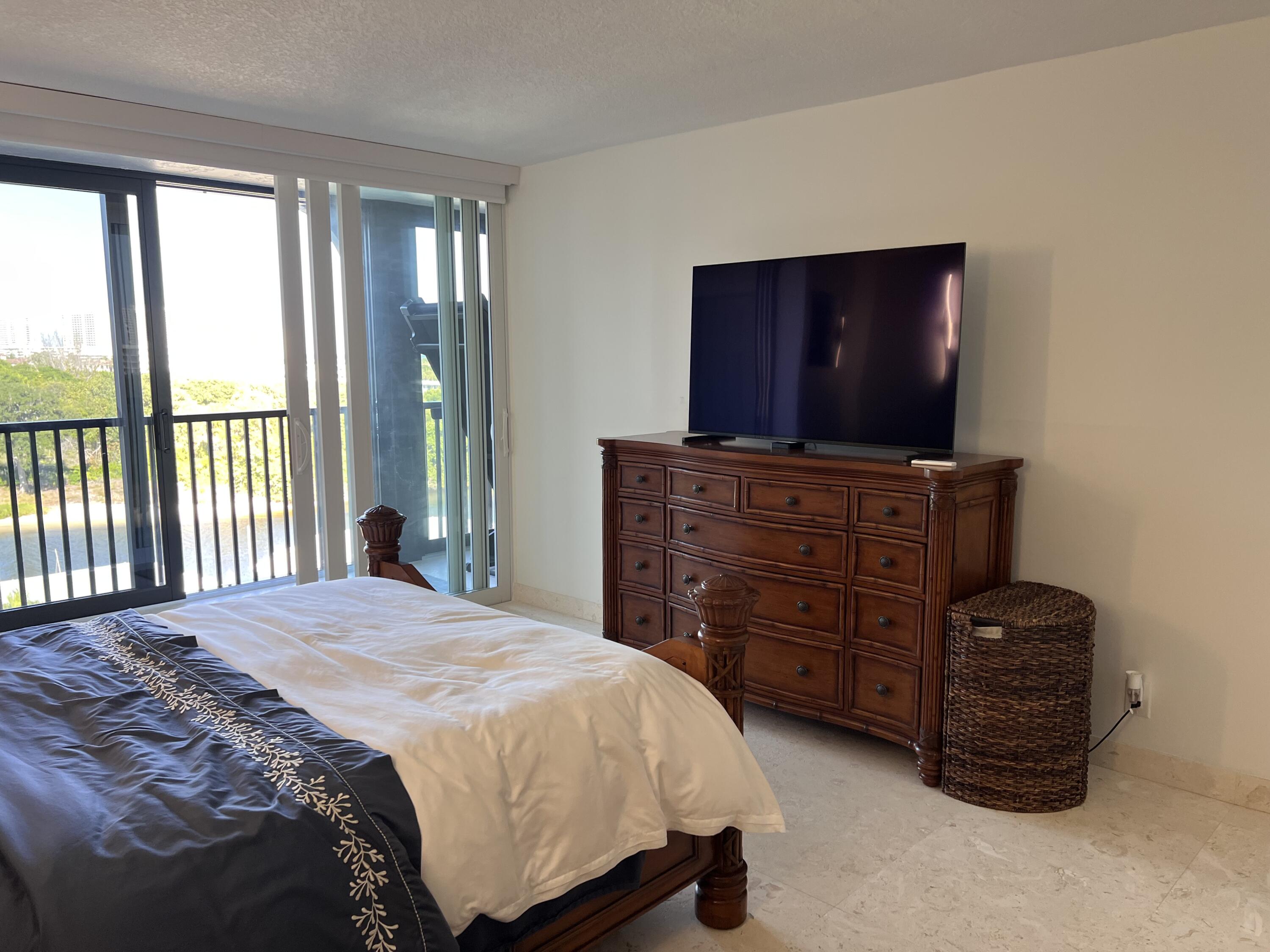 1629 Riverview Road, Unit 716 Deerfield Beach, FL 33441 - Photo 20 of 44 a bedroom with a bed and furniture