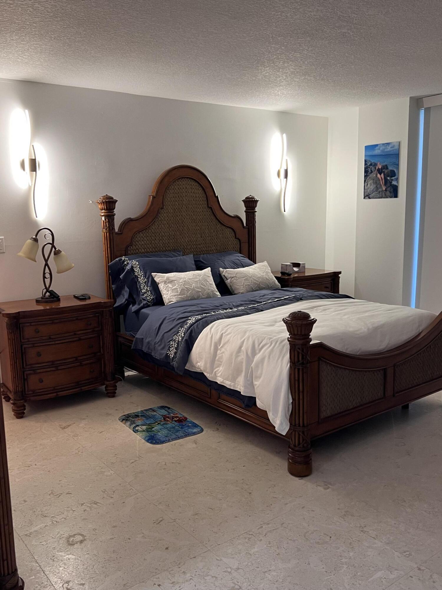 1629 Riverview Road, Unit 716 Deerfield Beach, FL 33441 - Photo 22 of 44 a bedroom with a bed and a dresser