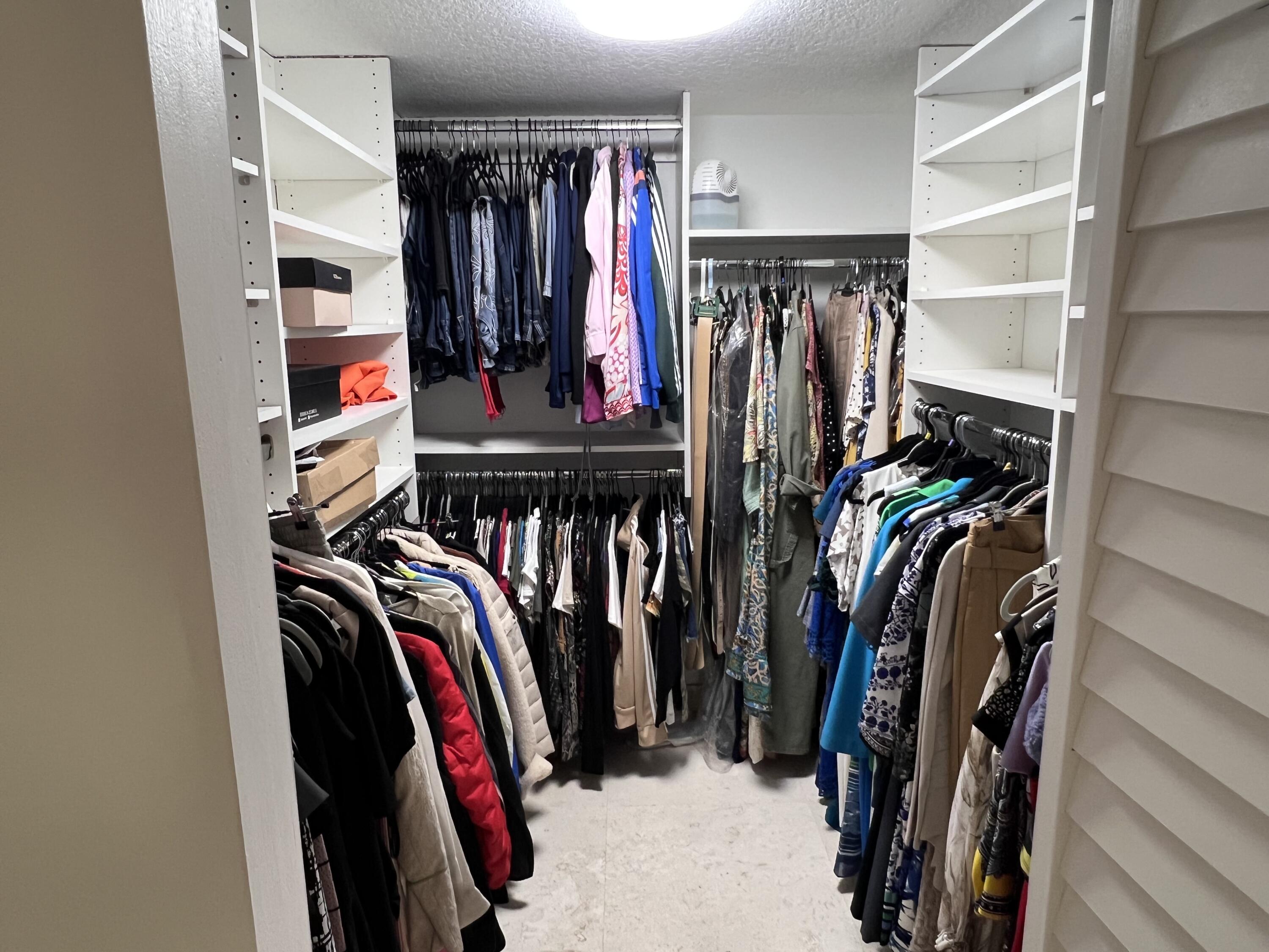 1629 Riverview Road, Unit 716 Deerfield Beach, FL 33441 - Photo 23 of 44 a view of walk in closet with clothes