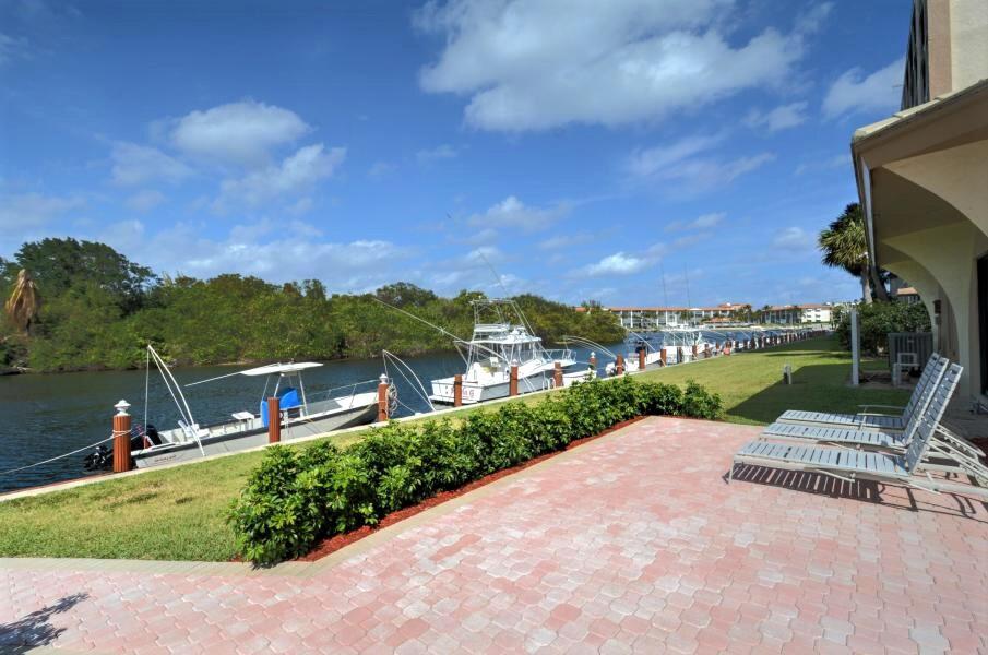 1629 Riverview Road, Unit 716 Deerfield Beach, FL 33441 - Photo 29 of 44 a view of a lake with a yard