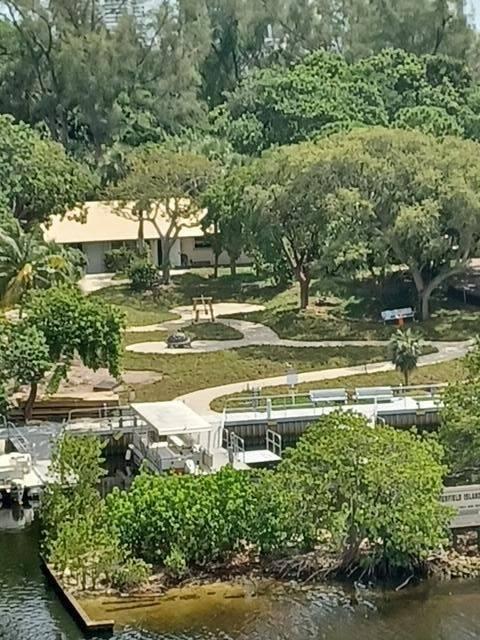 1629 Riverview Road, Unit 716 Deerfield Beach, FL 33441 - Photo 31 of 44 a view of a lake with a yard