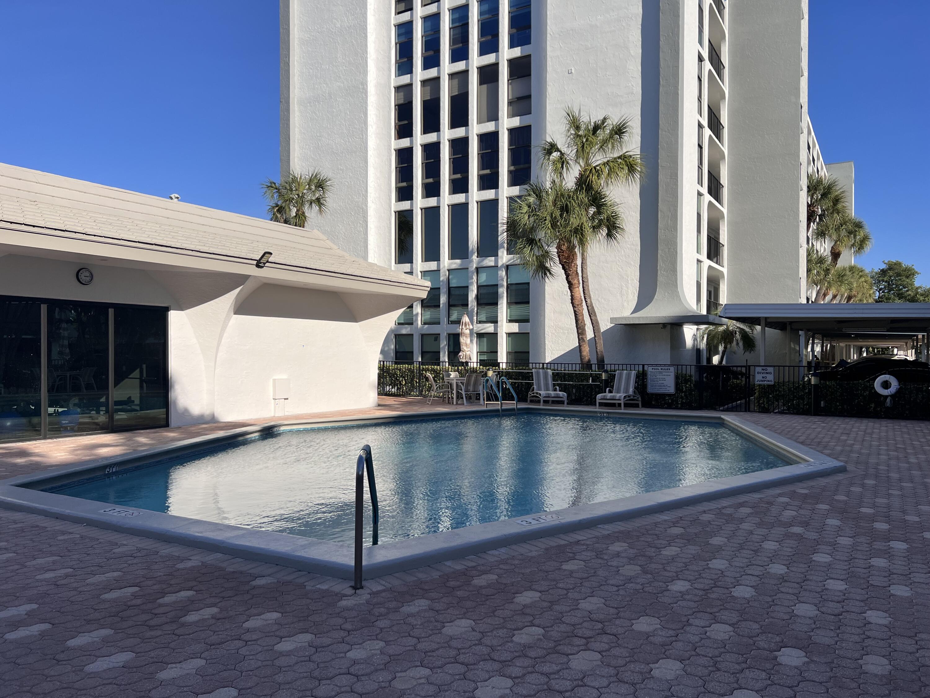 1629 Riverview Road, Unit 716 Deerfield Beach, FL 33441 - Photo 34 of 44 a view of a swimming pool with a patio