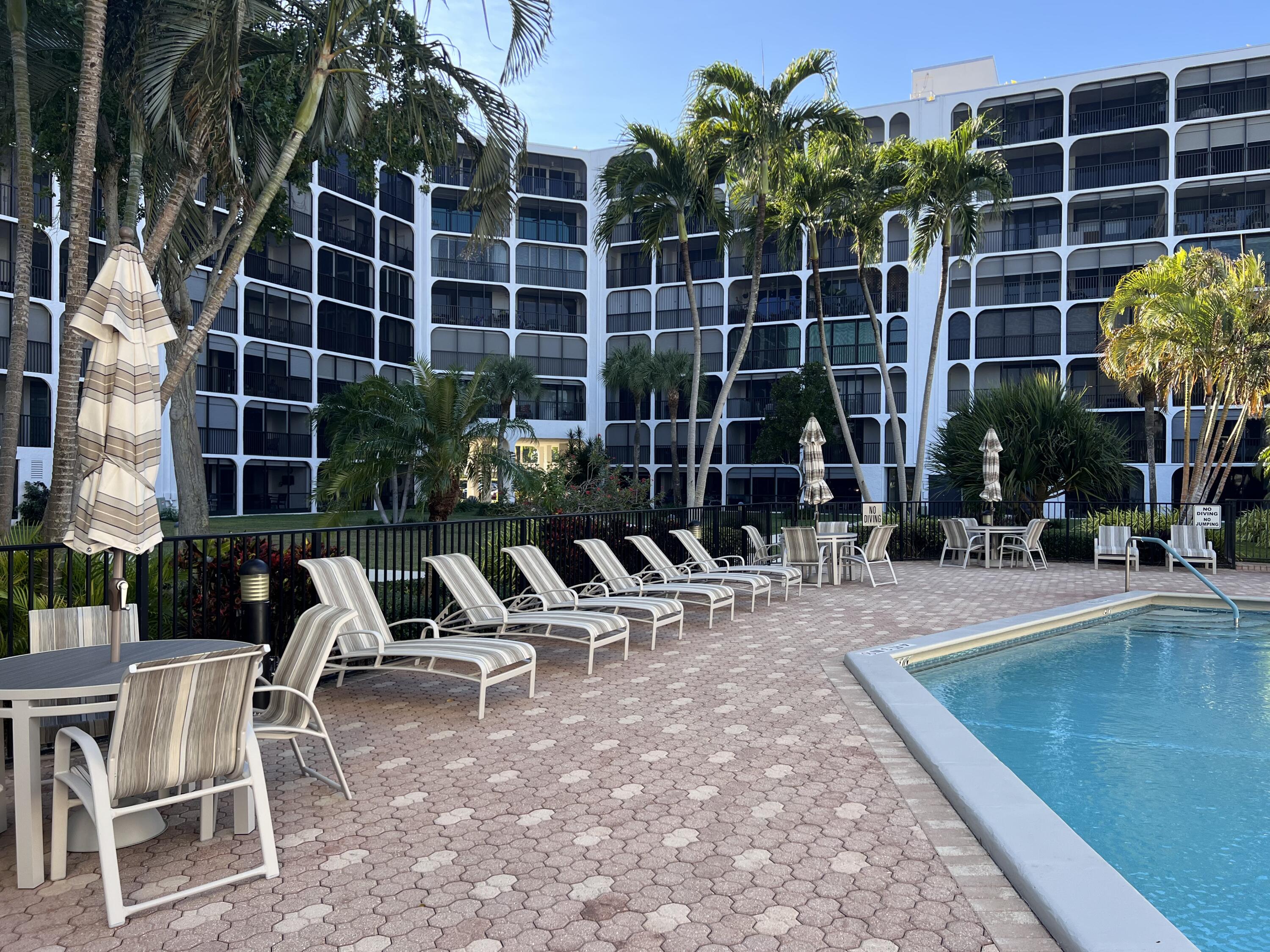 1629 Riverview Road, Unit 716 Deerfield Beach, FL 33441 - Photo 35 of 44 a view of a chairs and tables in patio