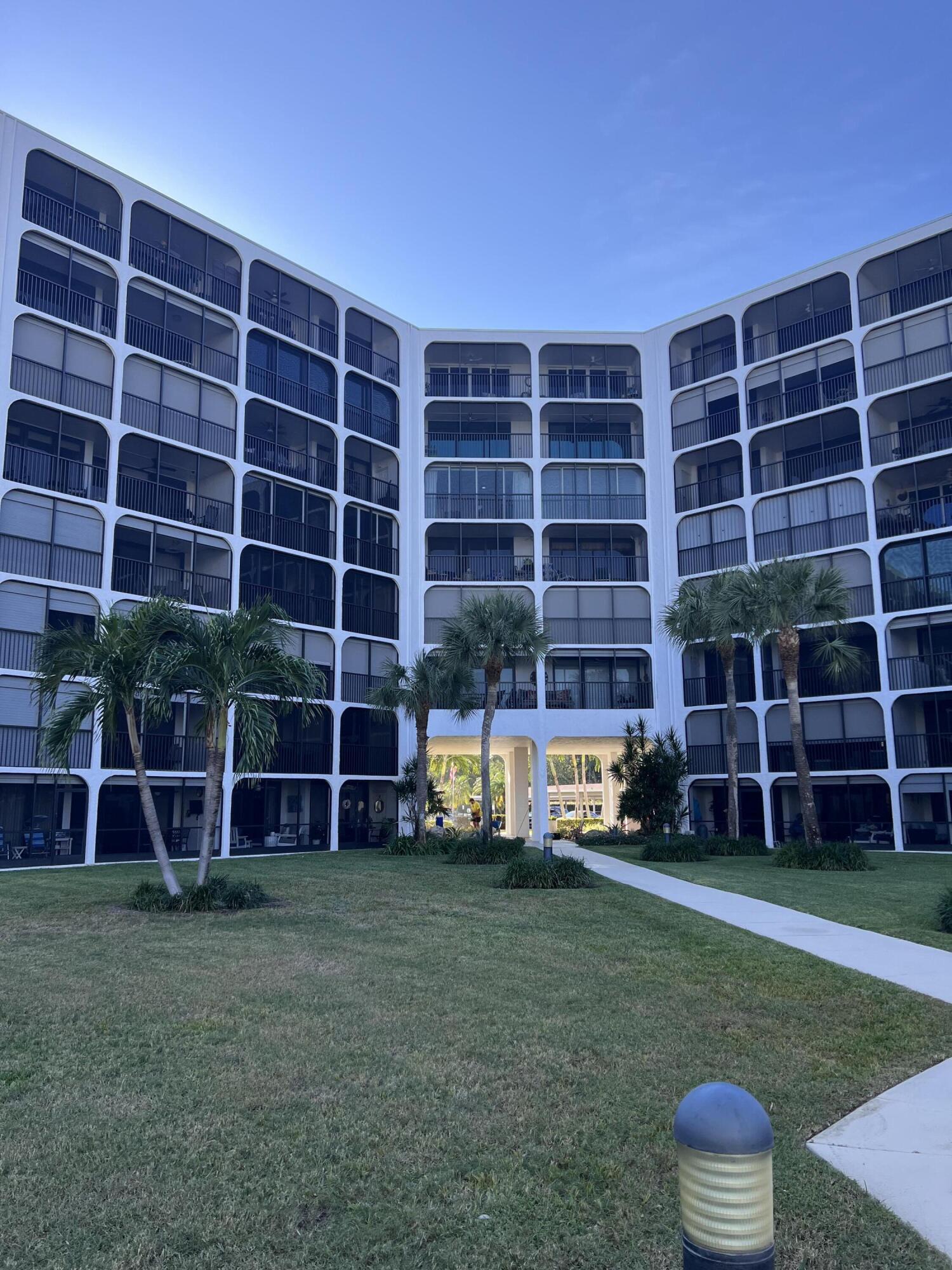 1629 Riverview Road, Unit 716 Deerfield Beach, FL 33441 - Photo 5 of 44 a view of a house with a yard and a large window