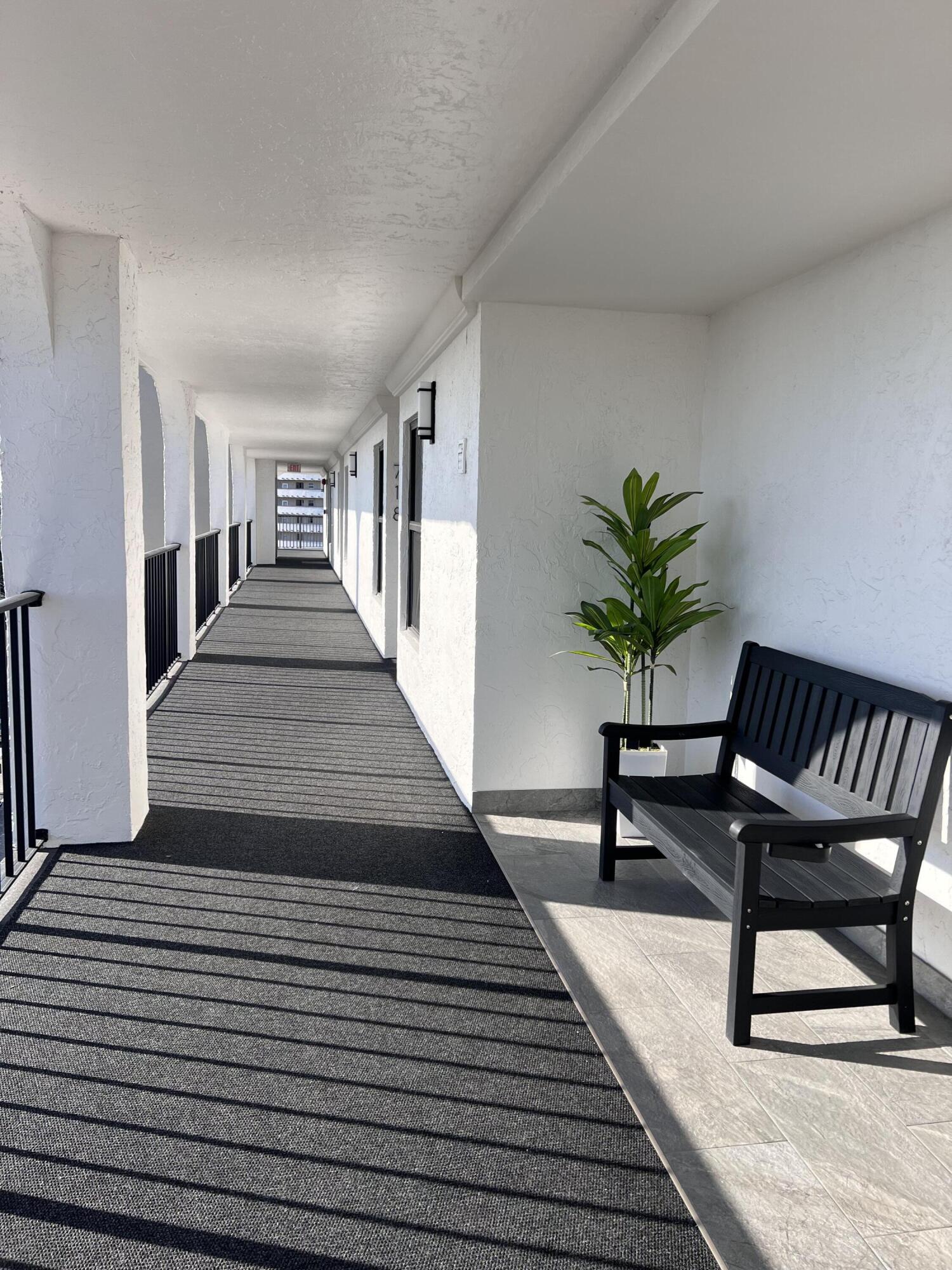 1629 Riverview Road, Unit 716 Deerfield Beach, FL 33441 - Photo 6 of 44 a living room with furniture and a potted plant