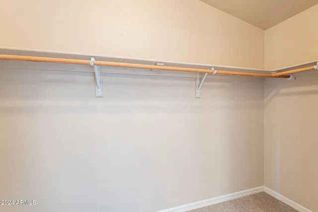 a view of an empty room with empty shelves