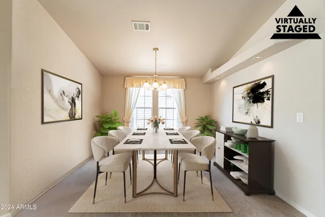 a view of a dining room with furniture window and outside view
