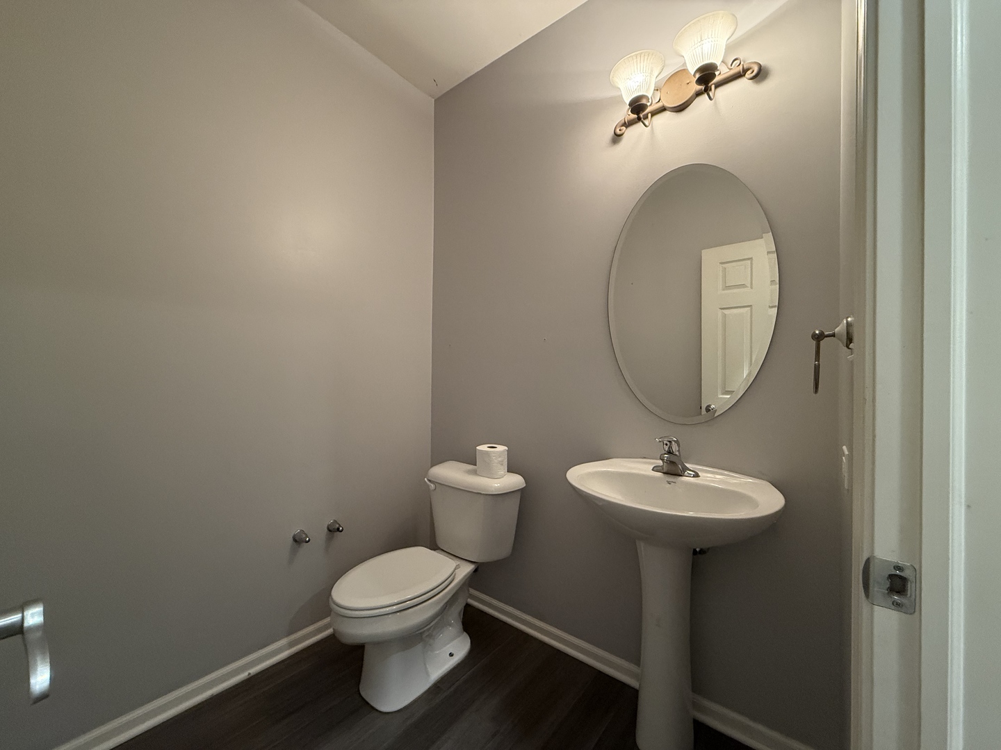 433 Acushnet Street, Unit 433 Elgin, IL 60124 - Photo 15 of 37 a bathroom with a toilet sink and mirror