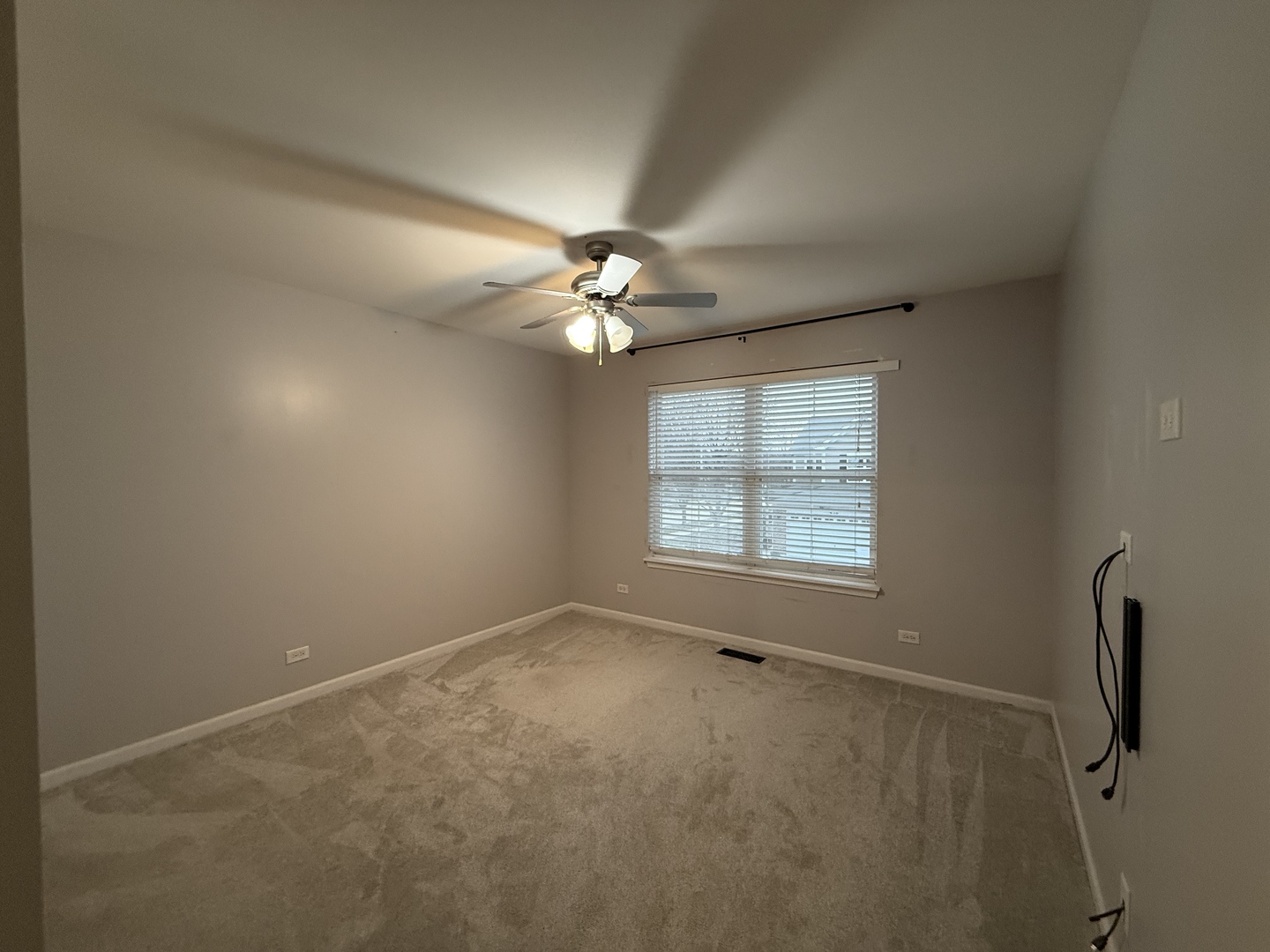 433 Acushnet Street, Unit 433 Elgin, IL 60124 - Photo 31 of 37 a view of a livingroom with a ceiling fan and window