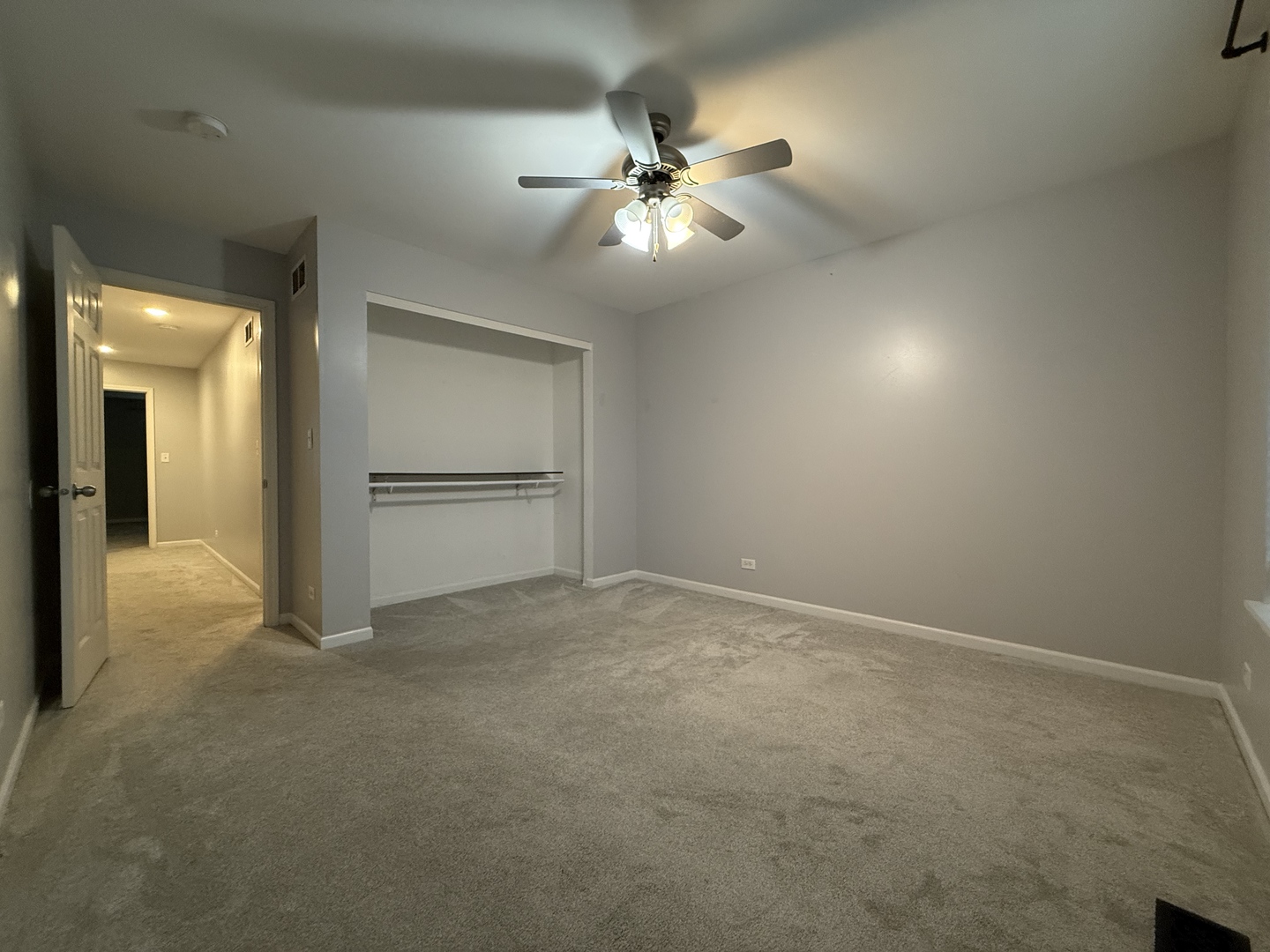 433 Acushnet Street, Unit 433 Elgin, IL 60124 - Photo 32 of 37 an empty room with closet and windows
