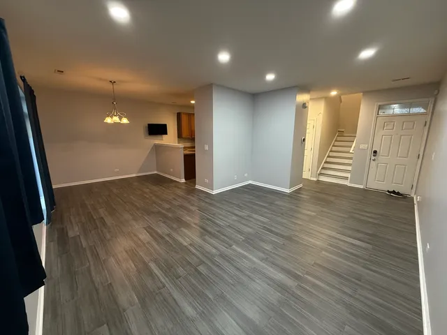 a view of a livingroom with a staircase