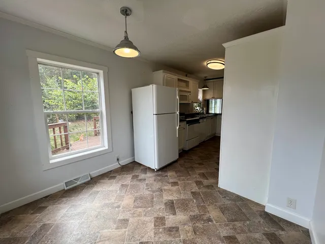 a view of a storage & utility room with a window
