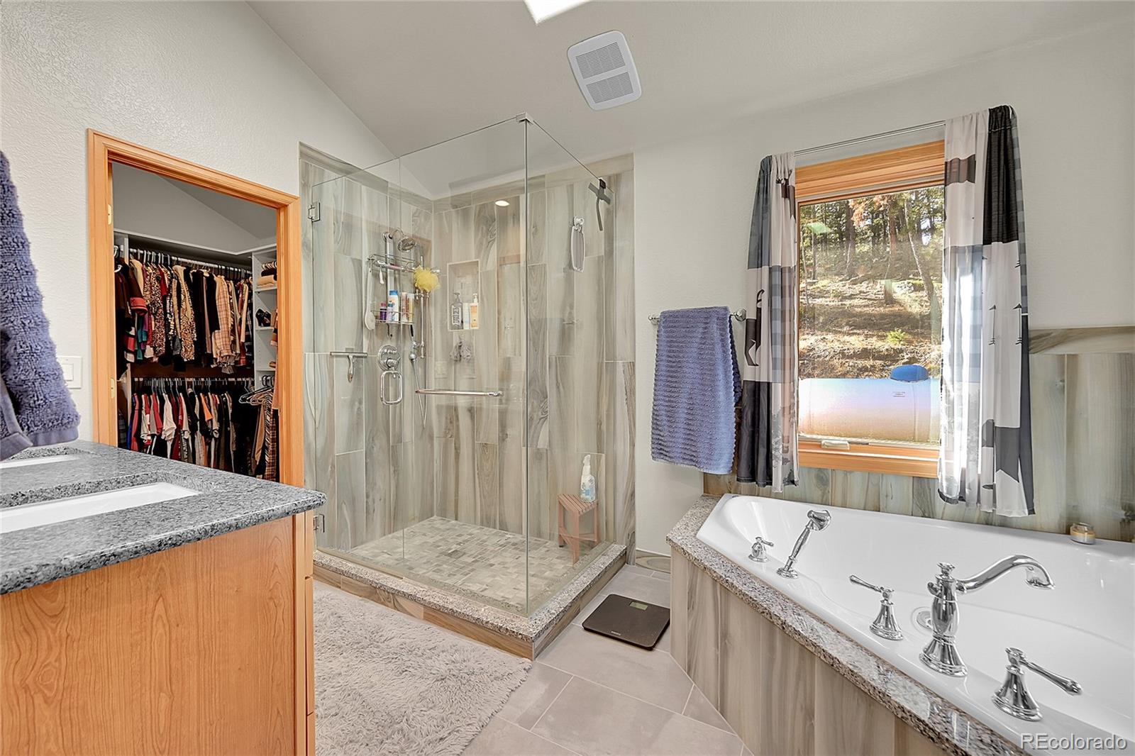 502 County Road 1034 Bailey, CO 80421 - Photo 13 of 20 a bathroom with a tub sink and mirror