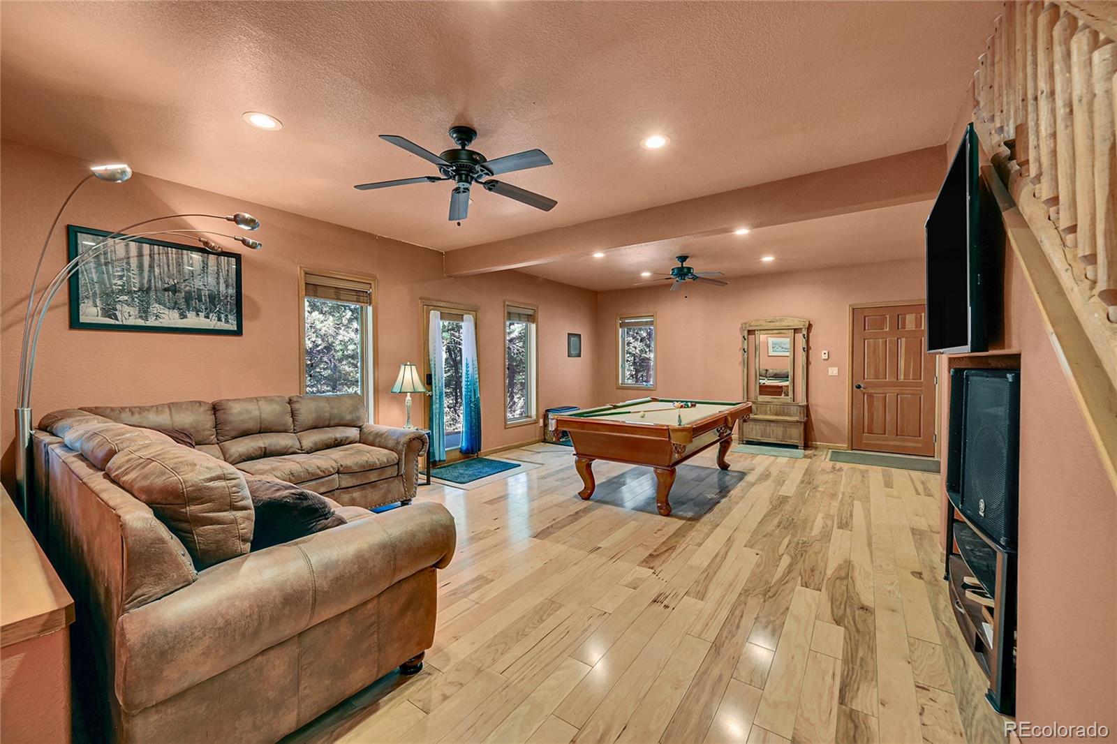 502 County Road 1034 Bailey, CO 80421 - Photo 14 of 20 a living room with furniture a rug and a ceiling fan