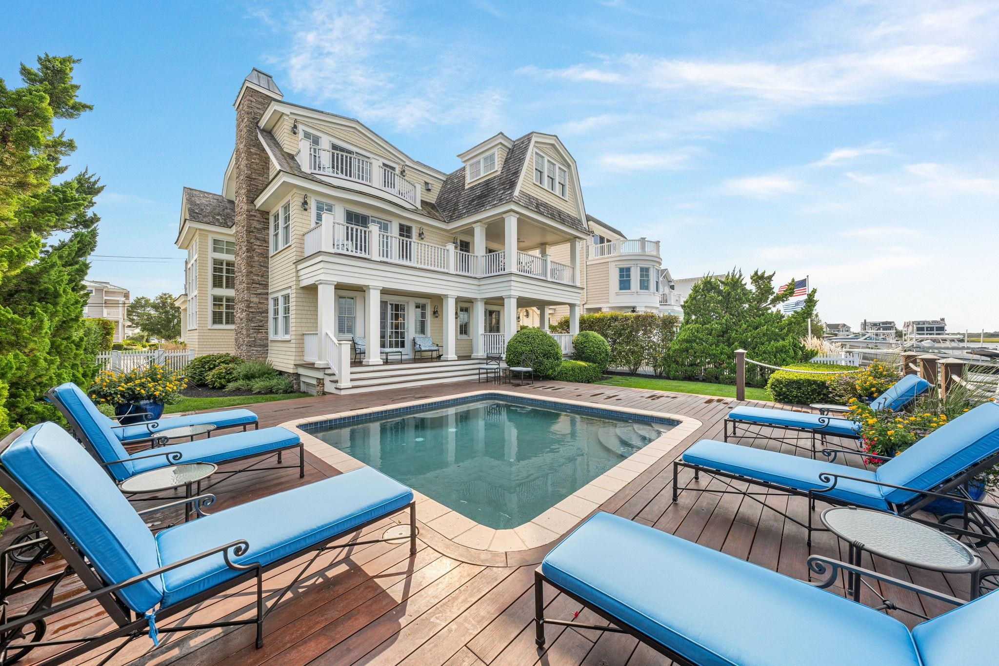 a view of a patio with swimming pool table and chairs