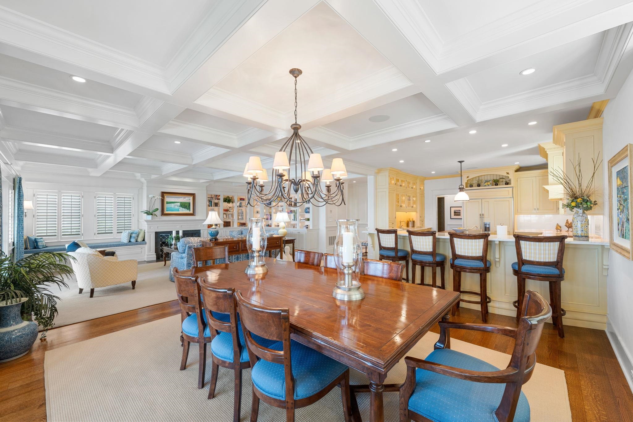 501 42nd Street Avalon, NJ 08202 - Photo 16 of 50 a view of a dining room and livingroom with furniture wooden floor a chandelier