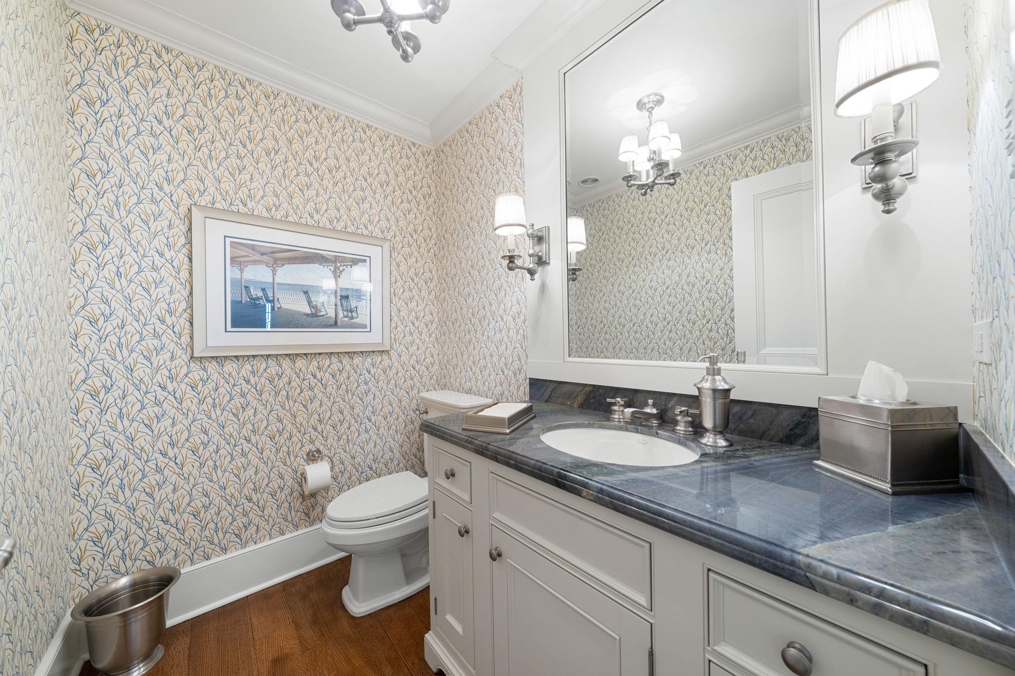 501 42nd Street Avalon, NJ 08202 - Photo 21 of 50 a bathroom with a granite countertop sink a toilet and a mirror