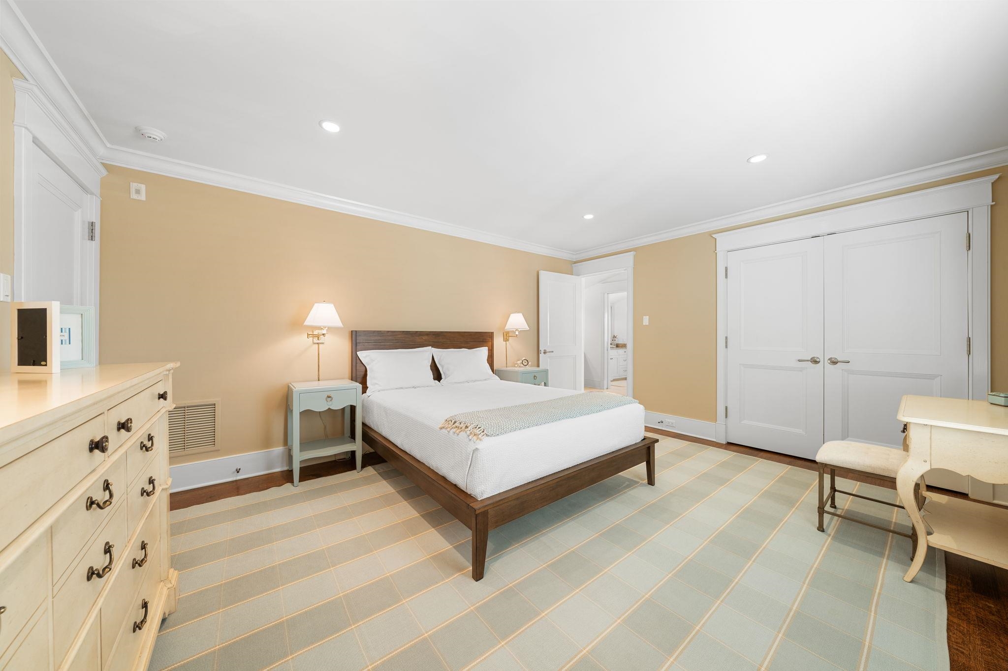 501 42nd Street Avalon, NJ 08202 - Photo 28 of 50 a spacious bedroom with a bed and a cabinets