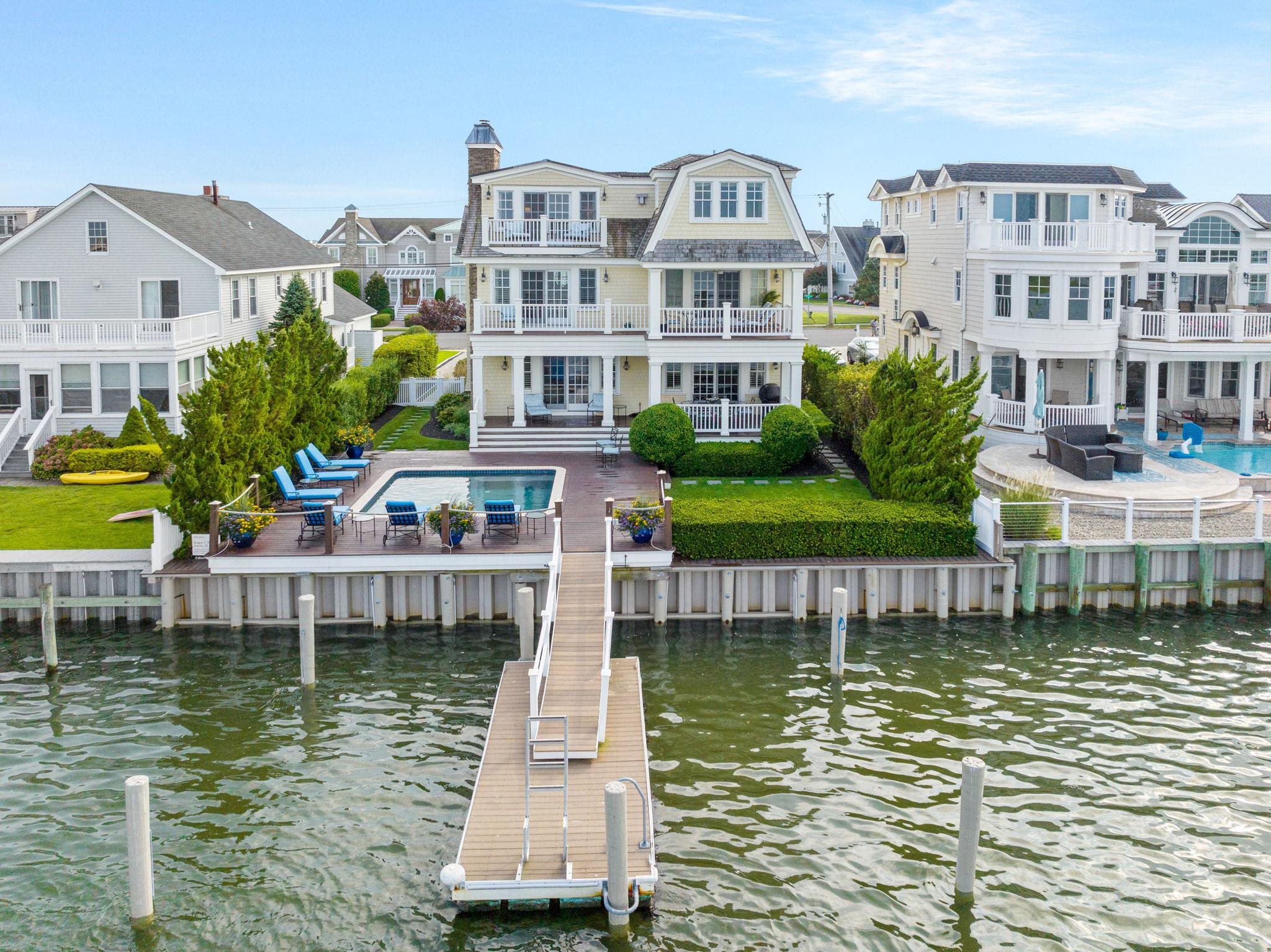 501 42nd Street Avalon, NJ 08202 - Photo 3 of 50 a view of residential houses with swimming pool and outdoor seating