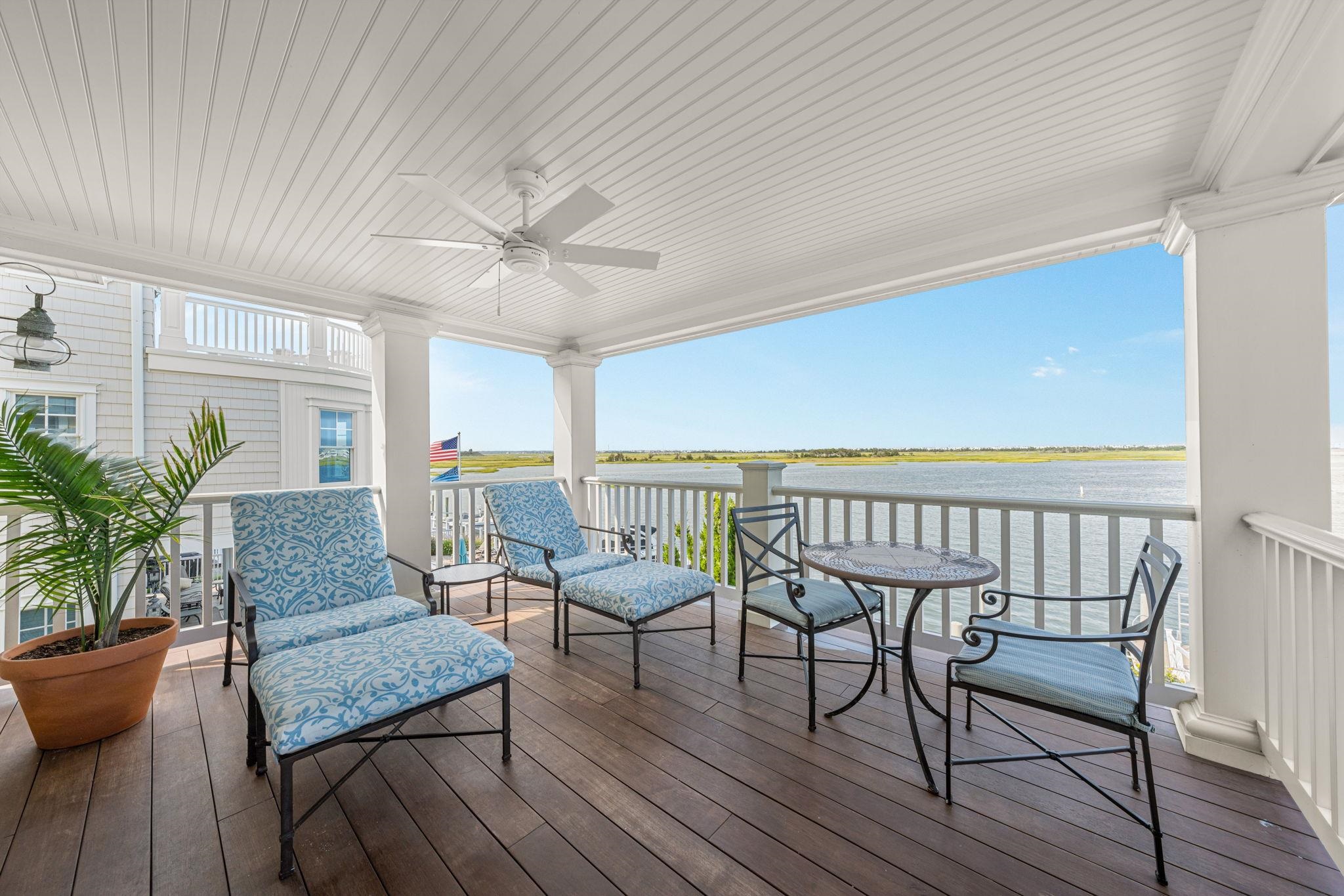 501 42nd Street Avalon, NJ 08202 - Photo 31 of 50 a balcony with furniture and wooden floor