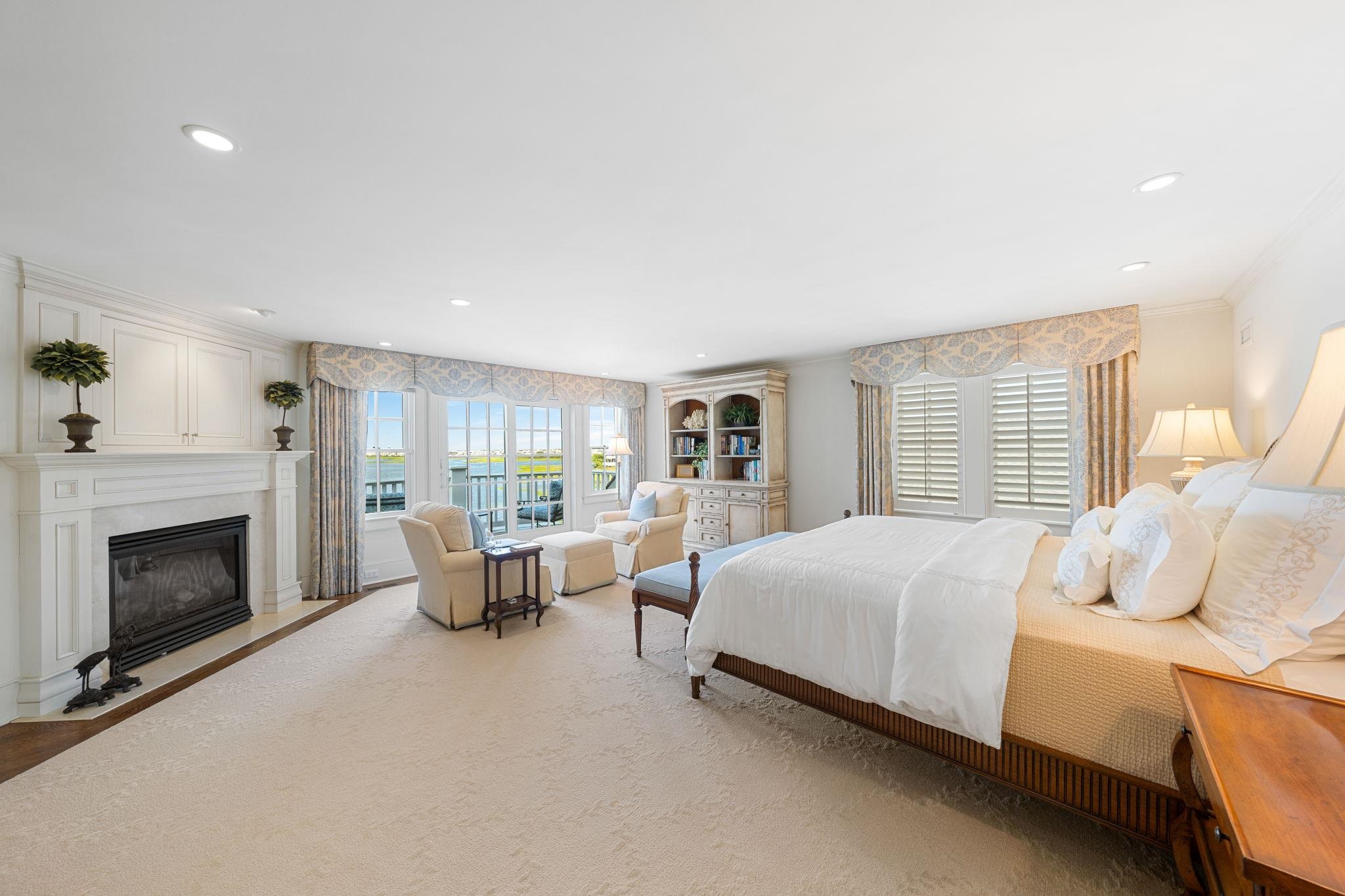 501 42nd Street Avalon, NJ 08202 - Photo 36 of 50 a bed room with a bed and a fireplace