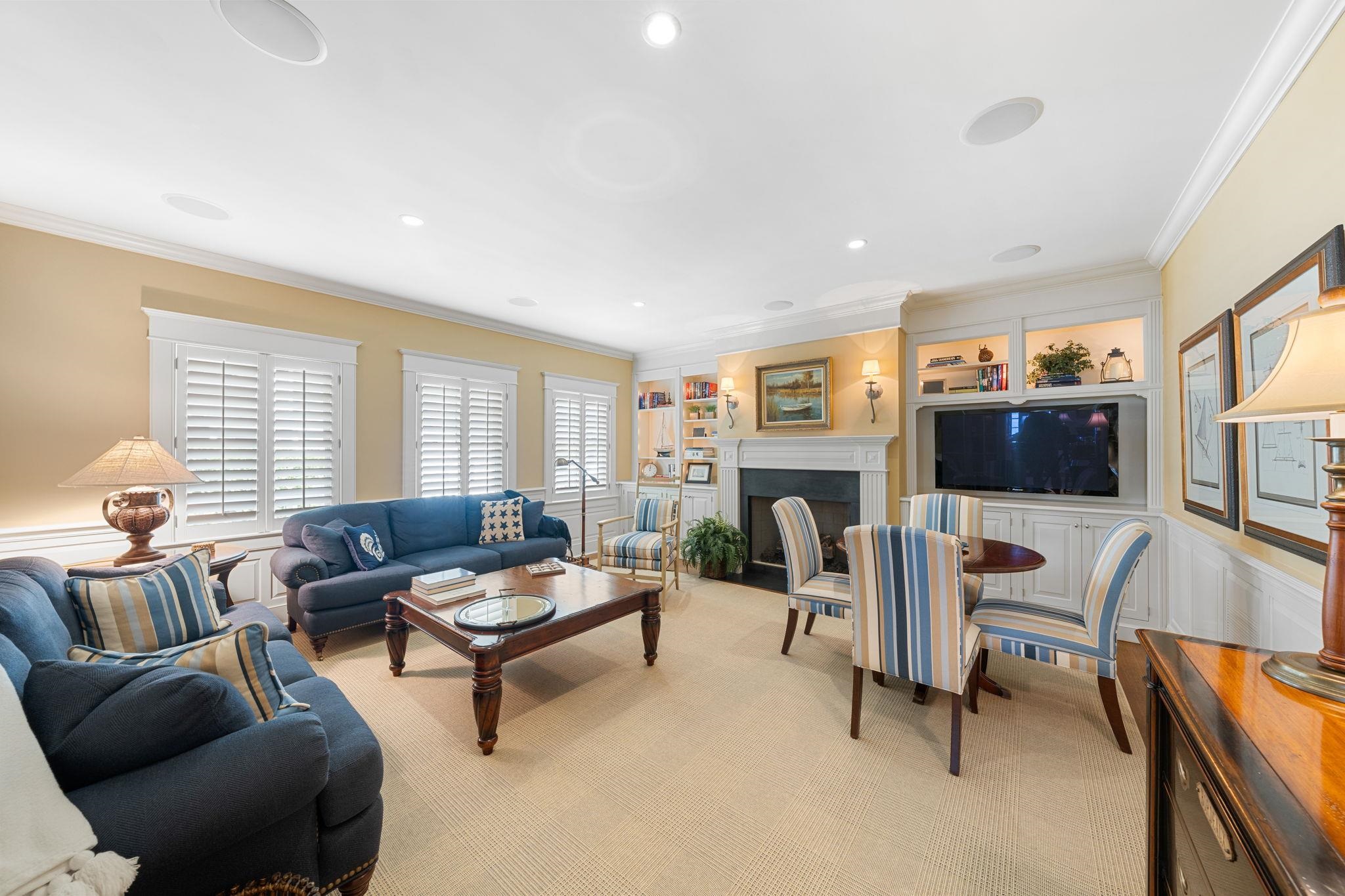 501 42nd Street Avalon, NJ 08202 - Photo 46 of 50 a living room with furniture and a flat screen tv