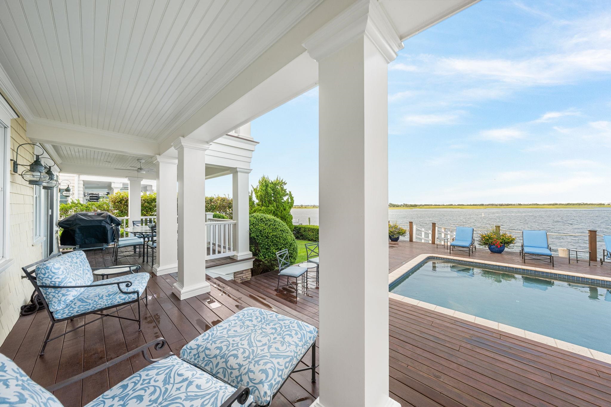 501 42nd Street Avalon, NJ 08202 - Photo 48 of 50 a balcony with furniture and a potted plant