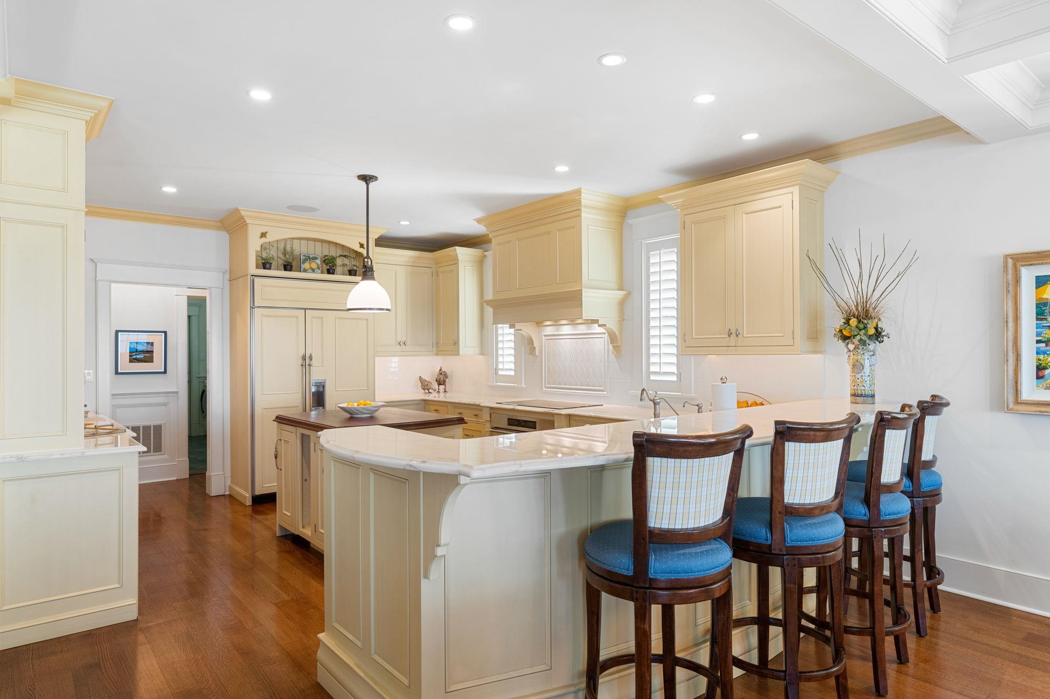 501 42nd Street Avalon, NJ 08202 - Photo 8 of 50 a kitchen with a dining table chairs and wooden floor
