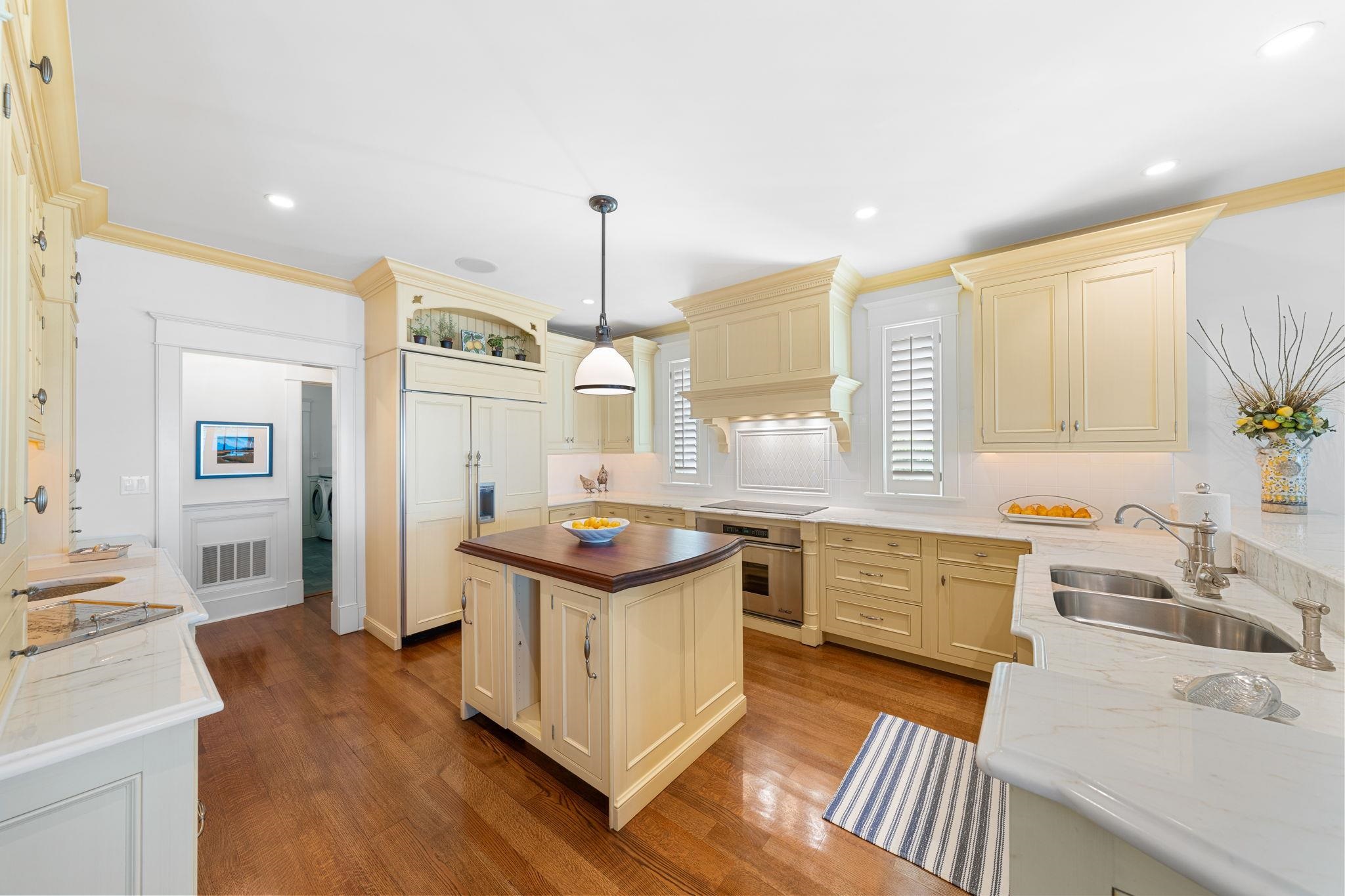 501 42nd Street Avalon, NJ 08202 - Photo 9 of 50 a kitchen with stainless steel appliances a sink stove and cabinets
