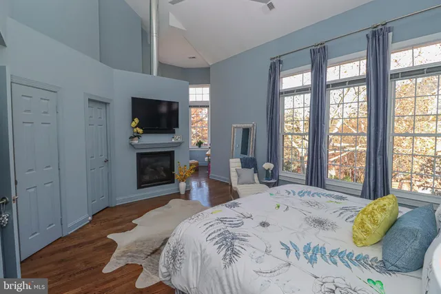 a bed room with a bed and a television