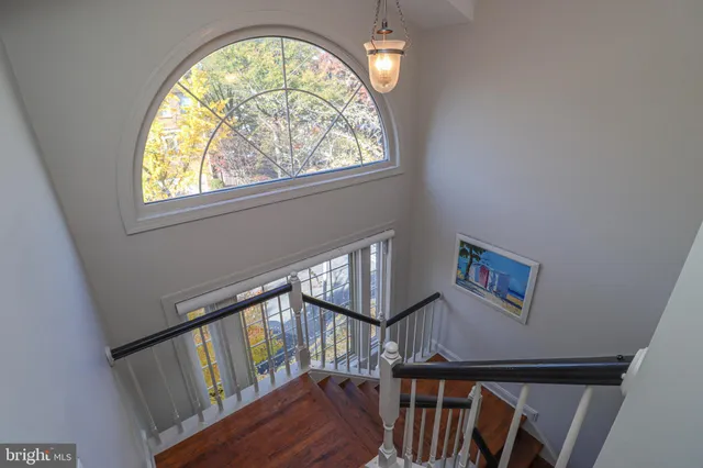 a view of an entryway with wooden floor