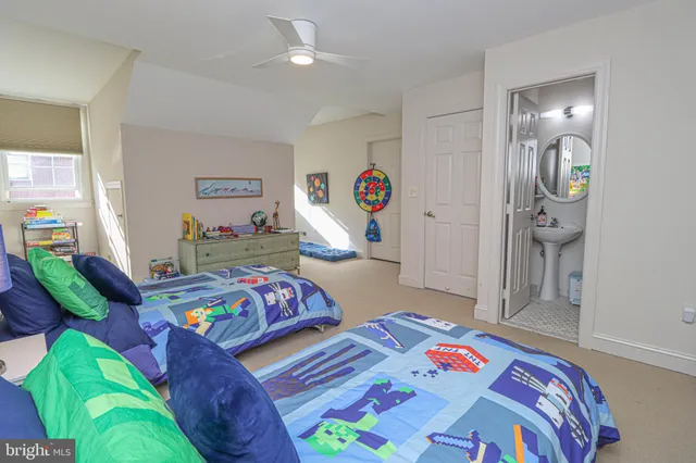 a bedroom with bed and a wooden floor