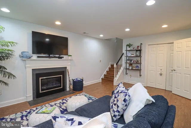 a living room with furniture fireplace and flat screen tv