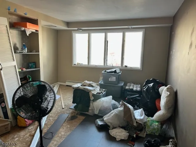 a room with lots of chairs and a chandelier