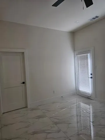 a bathroom with a shower and toilet