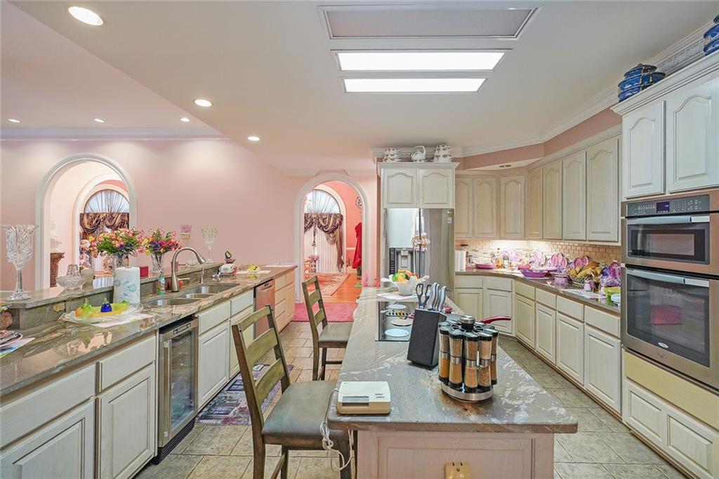 1827 Poplar Springs Road Hiram, GA 30141 - Photo 11 of 45 a kitchen with a sink appliances and cabinets