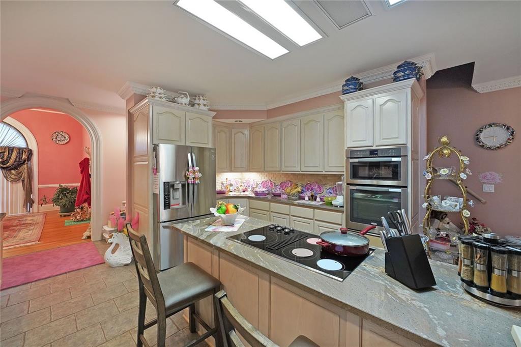 1827 Poplar Springs Road Hiram, GA 30141 - Photo 12 of 45 a kitchen that has a lot of cabinets a stove and a refrigerator