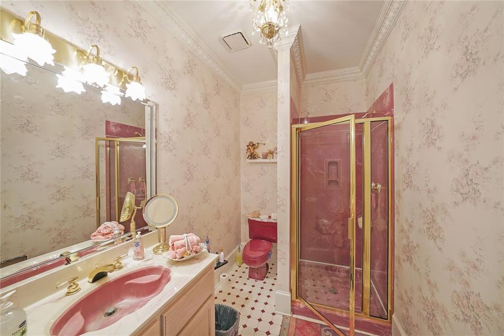 1827 Poplar Springs Road Hiram, GA 30141 - Photo 16 of 45 a bathroom with a sink a toilet and shower