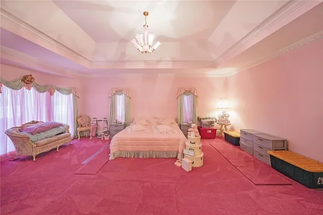 a large kitchen with a counter space a sink and cabinets
