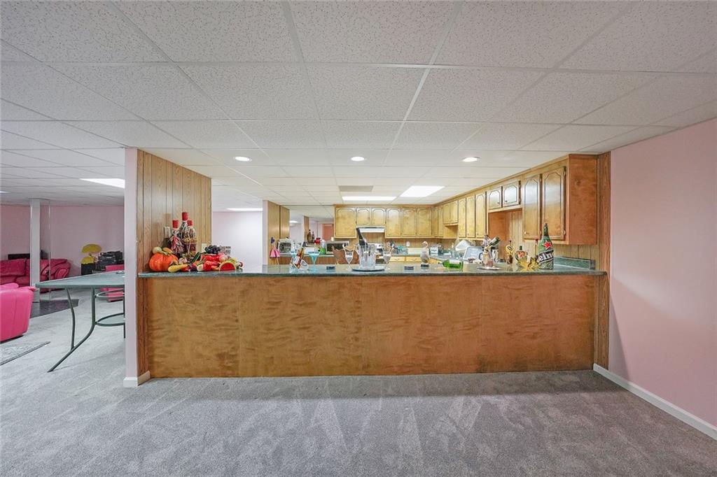 1827 Poplar Springs Road Hiram, GA 30141 - Photo 32 of 45 a view of kitchen and dining area with wooden floor