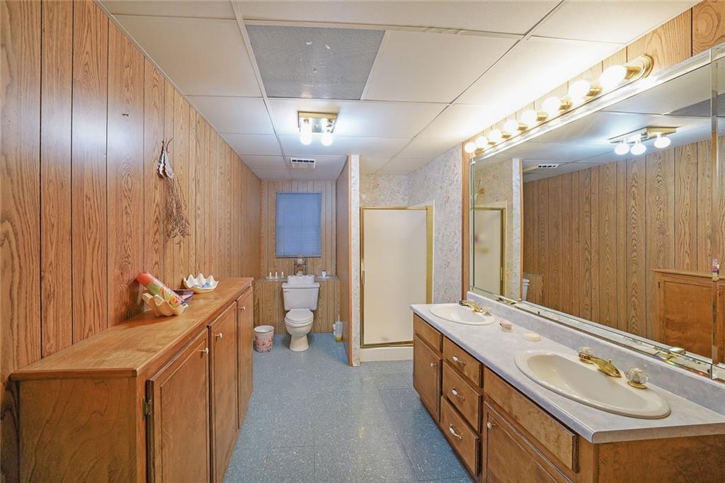 1827 Poplar Springs Road Hiram, GA 30141 - Photo 33 of 45 a bathroom with a double vanity sink and a mirror