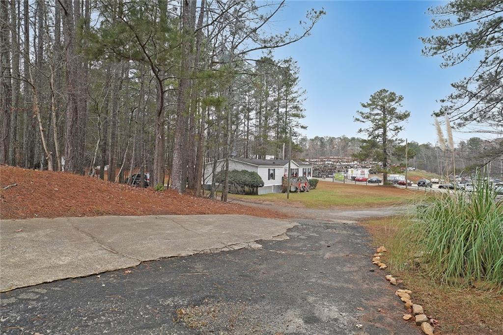 1827 Poplar Springs Road Hiram, GA 30141 - Photo 36 of 45 a view of yard with swimming pool and trees