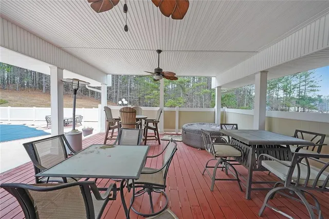 a dining room with wooden floor and furniture