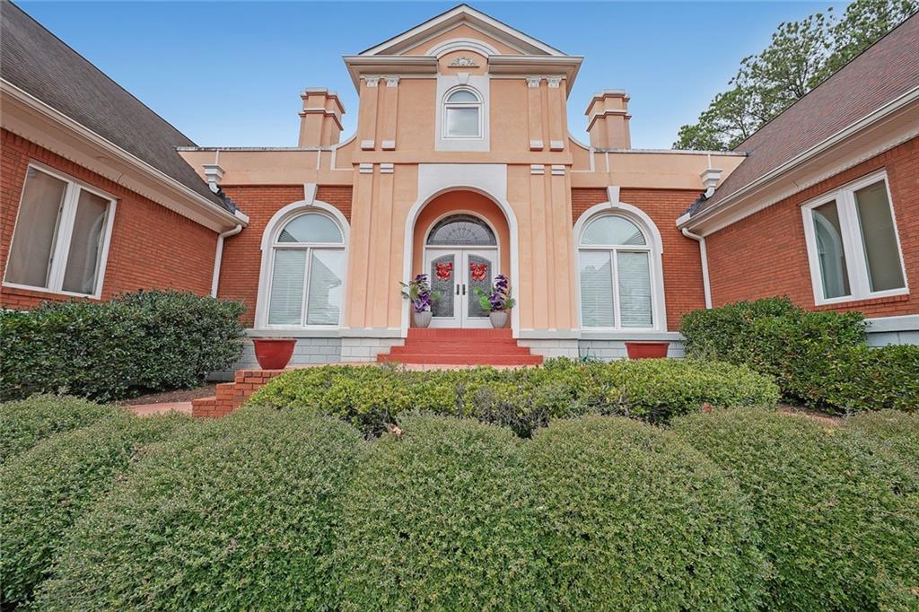 1827 Poplar Springs Road Hiram, GA 30141 - Photo 5 of 45 a front view of a house with garden
